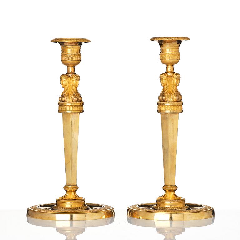 A pair of French Empire candlesticks, early 19th century.