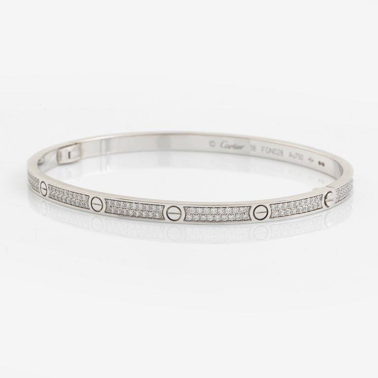 A Cartier "Love" bracelet small model in 18K white gold with round brilliant-cut diamonds.