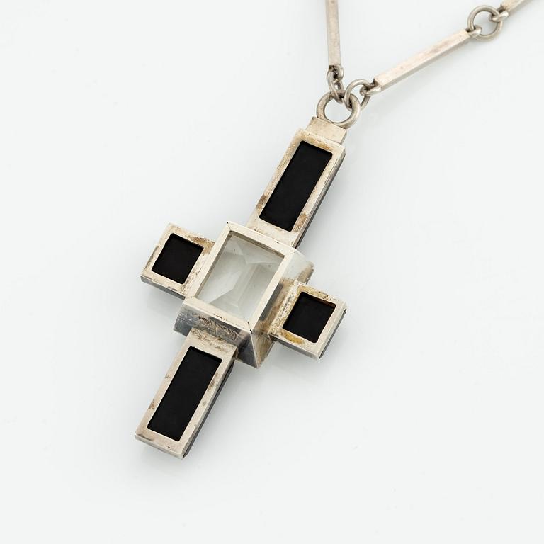 Wiwen Nilsson, a pendant, silver with rock crystal and onyx, in the form of a cross, Lund 1939.