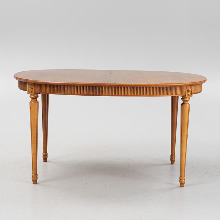 A Gustavian style dining table with two armchairs and four chairs, late 20th century.