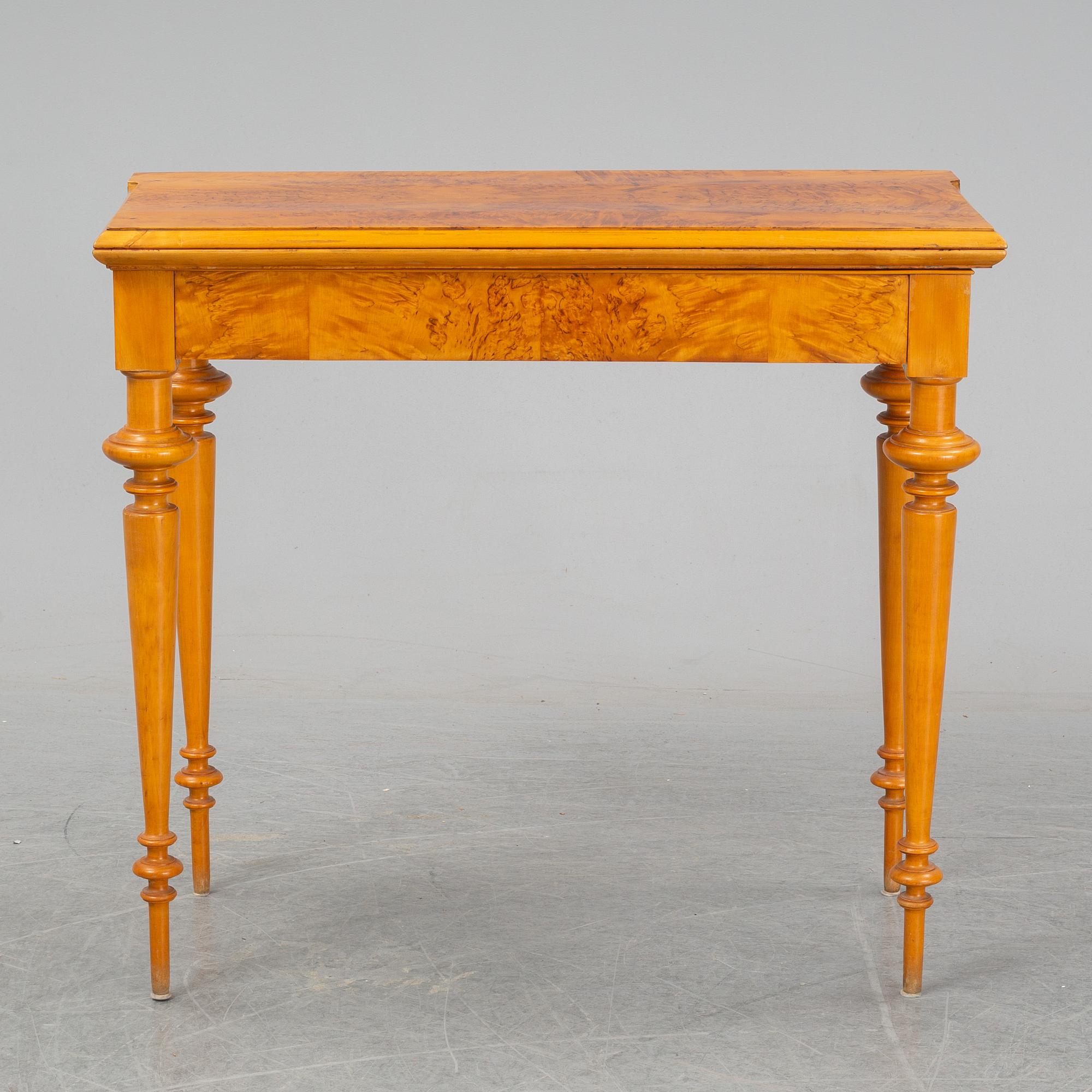 An early 20th Century birch card table.