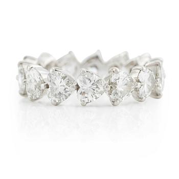 A Graff platinum eternity band set with heart shaped diamonds.