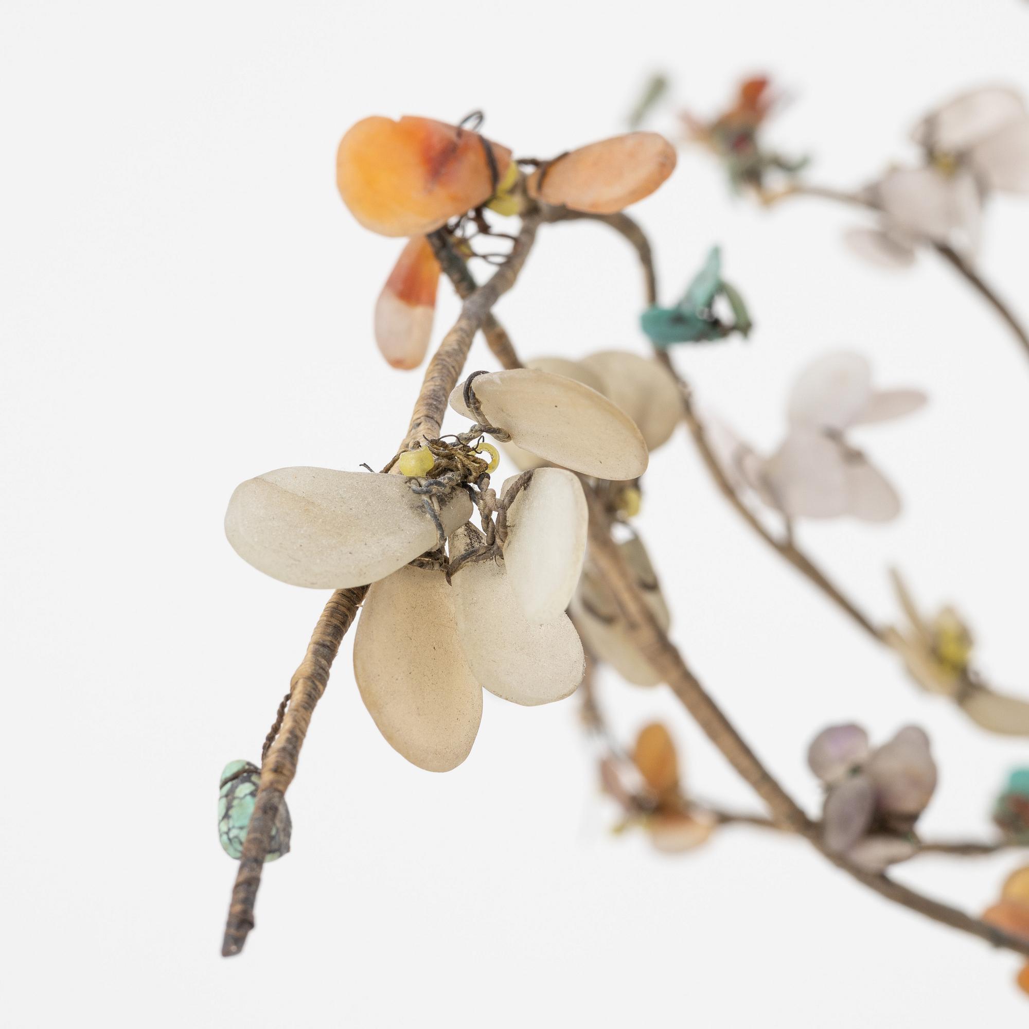 A decorative sculpture of a tree, made from nephrite, quartz, turkoise and lapis lazuli. China, 20th Century.