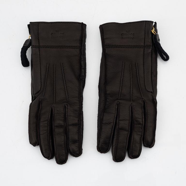 Gucci, a pair of dark brown leather gloves, size 6 1/2.