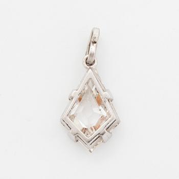 A platinum and step-cut diamond pendant.