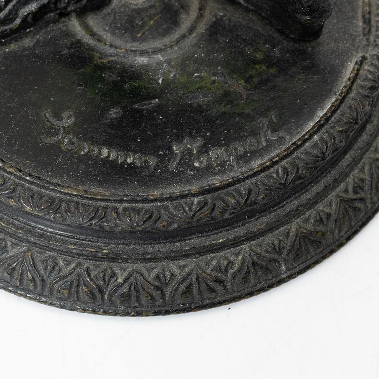 Two bronze sculptures.