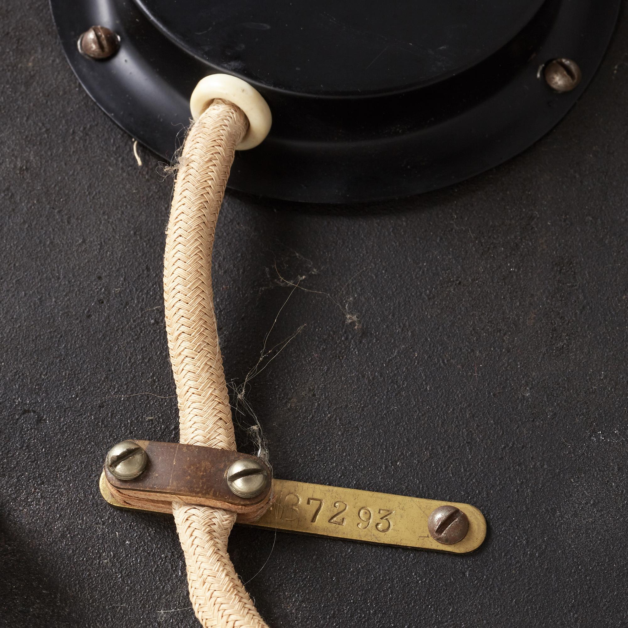 A Swedish Modern brass and black lacquered floor lamp, 1950's.