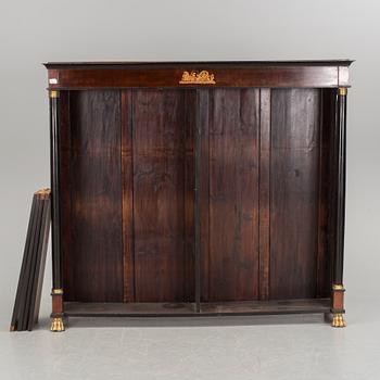 A mid 1800s Empire bookcase.