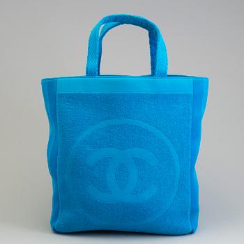 A Jumbo Bright Turquoise Blue "CC" Logo Cotton TERRY Cloth Beach Bag TOTE by Chanel and matching towel.