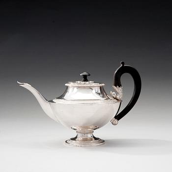 A TEA POT.