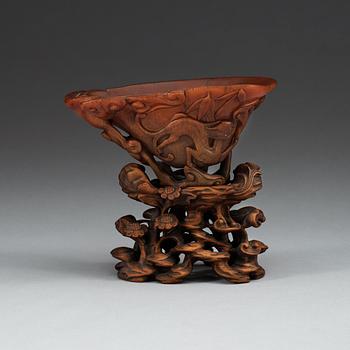 A finely carved rhinoceros libation cup, Qing dynasty, Kangxi (1662-1722).