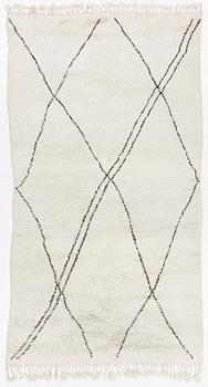 A Moroccan carpet, c. 282 x 150 cm.
