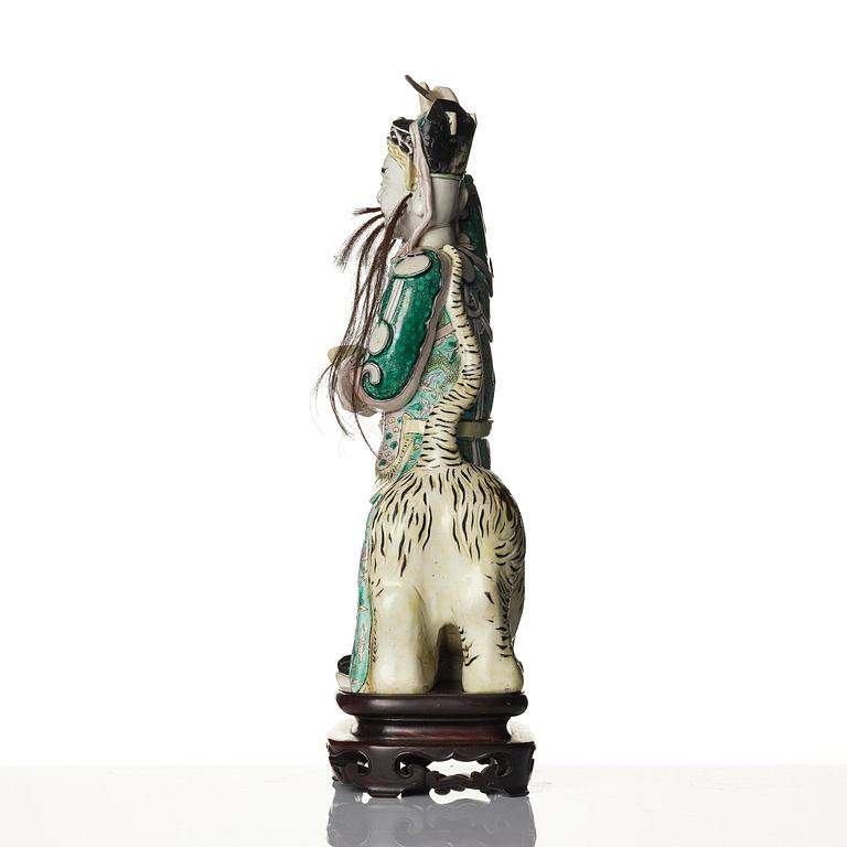 A famille verte bisquit figure of a warrior, Qing dynasty, 19th century.