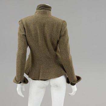 Green wool jacket and a turtleneck by Ralph Lauren.