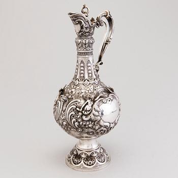 A silver wine jug, mark of J. Aldwinckle &  J. Slater, London 1881.