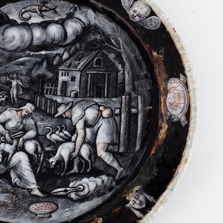 A Limoges grisaille enamel plate representing the month of June in the manner of Jean Miette, 16th/17th century.