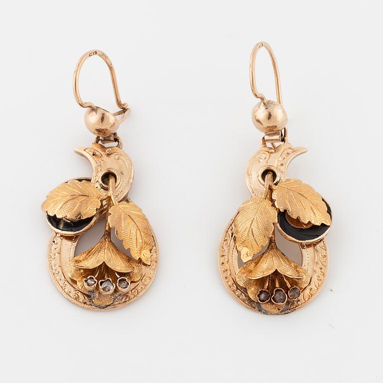 A pair of enamel and rose cut diamond earrings.