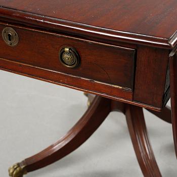 A drop-leaf table, English style, late 19th century.