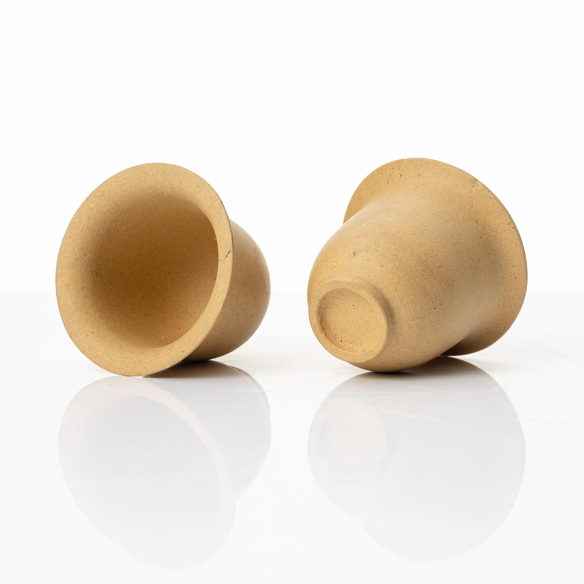 A set of a yellow yixing 'gongfu' teapot and four cups, China, 1980s.