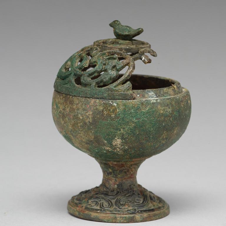 A group of five bronze objects, some Han dynasty (206 BC - 220 AD).