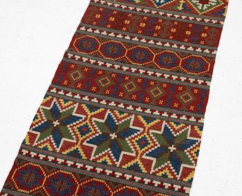 A bench cushion, flat weave, c. 262 x 64 cm, Scania, around the year 1900.