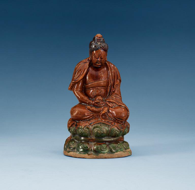 A ceramic figure of Buddha, Ming dynasty, 17th Century.