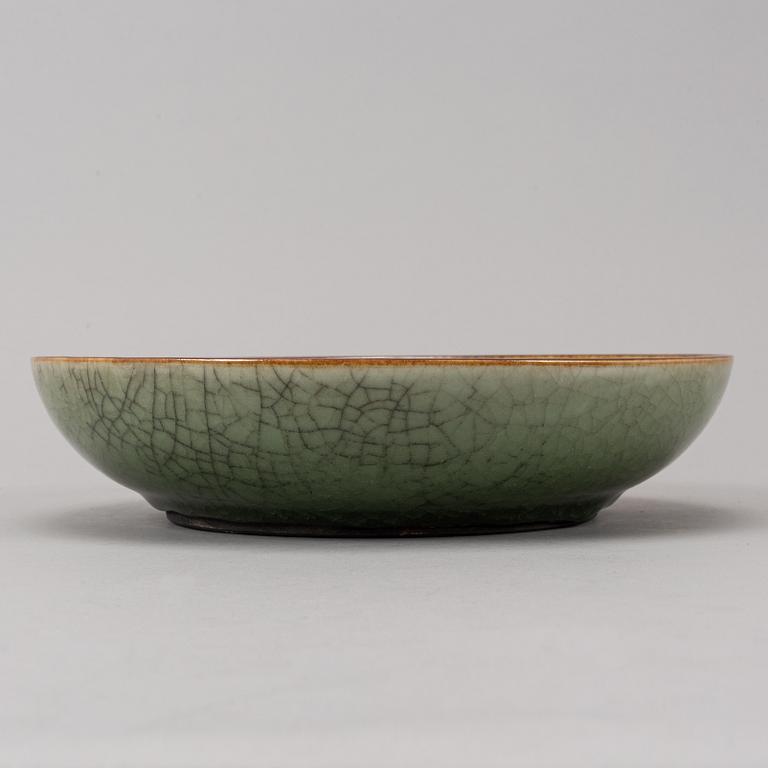 A sang de boef glazed bowl and a ge glazed dish, China, second half of the 20th Century.