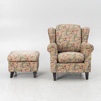 A "Djursholm" armchair with ottoman, Sweden, early 21st century.
