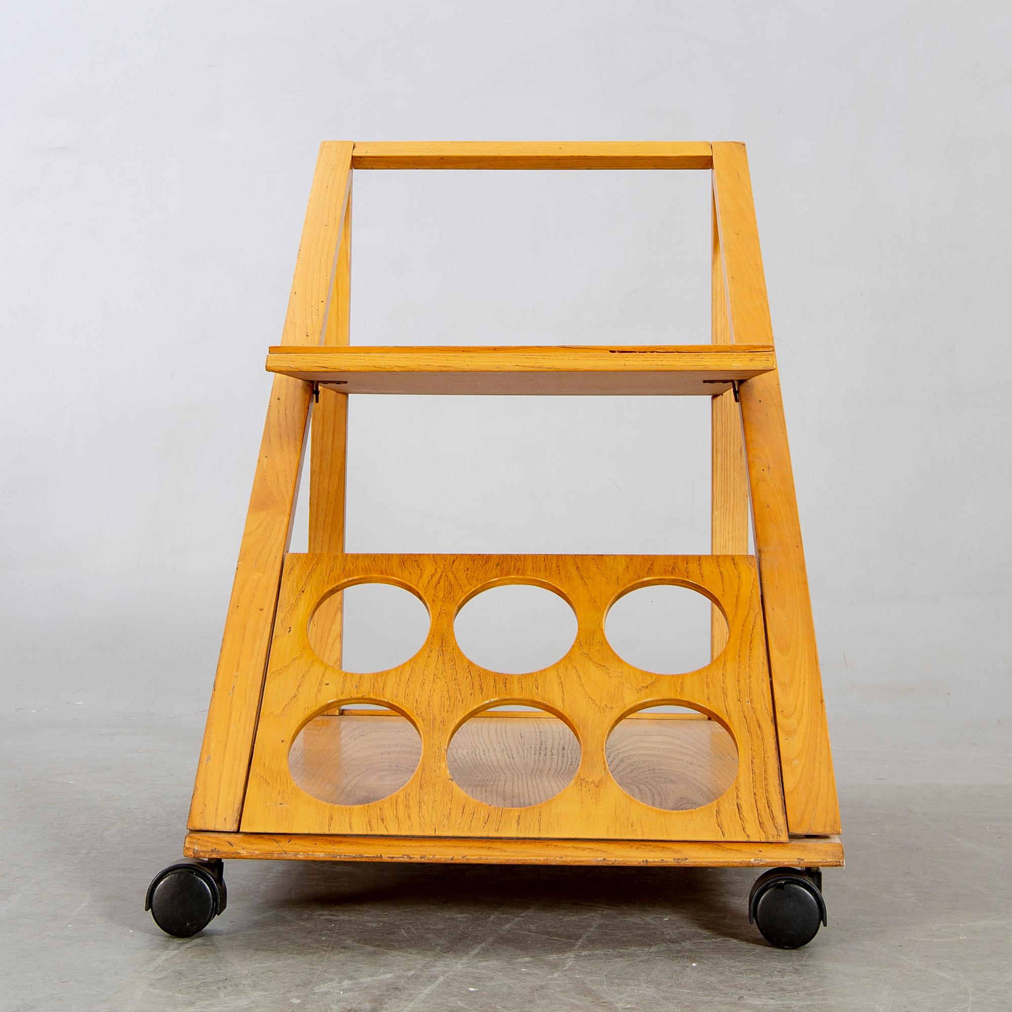 An Italian oak trolley later part of the 20th century.