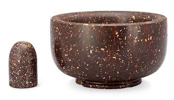 A Swedish 19th century porphyry mortar and pestle.