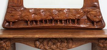 An Art Nouveau oak wall mirror with a console table.