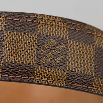 A belt by Louis Vuitton.