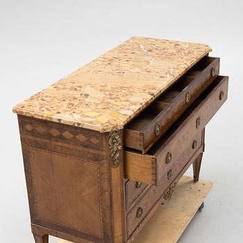 A Louis XVI-style marquetry and marble commode, later part of the 19th century.