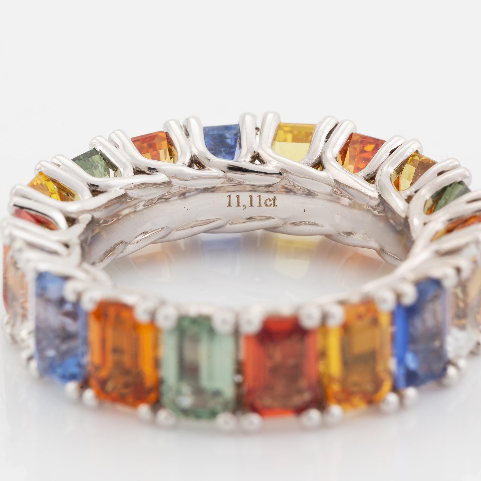 Emerald cut multi coloured sapphire ring.
