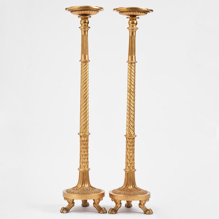 A pair of late Gustavian giltwood torchères by J. Frisk (master in Stockholm 1805-24).