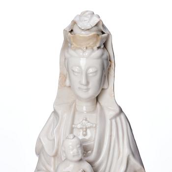 A Chinese blanc de chine Guanyin with attendants, Dehua, late Ming dynasty/early Qing dynasty.