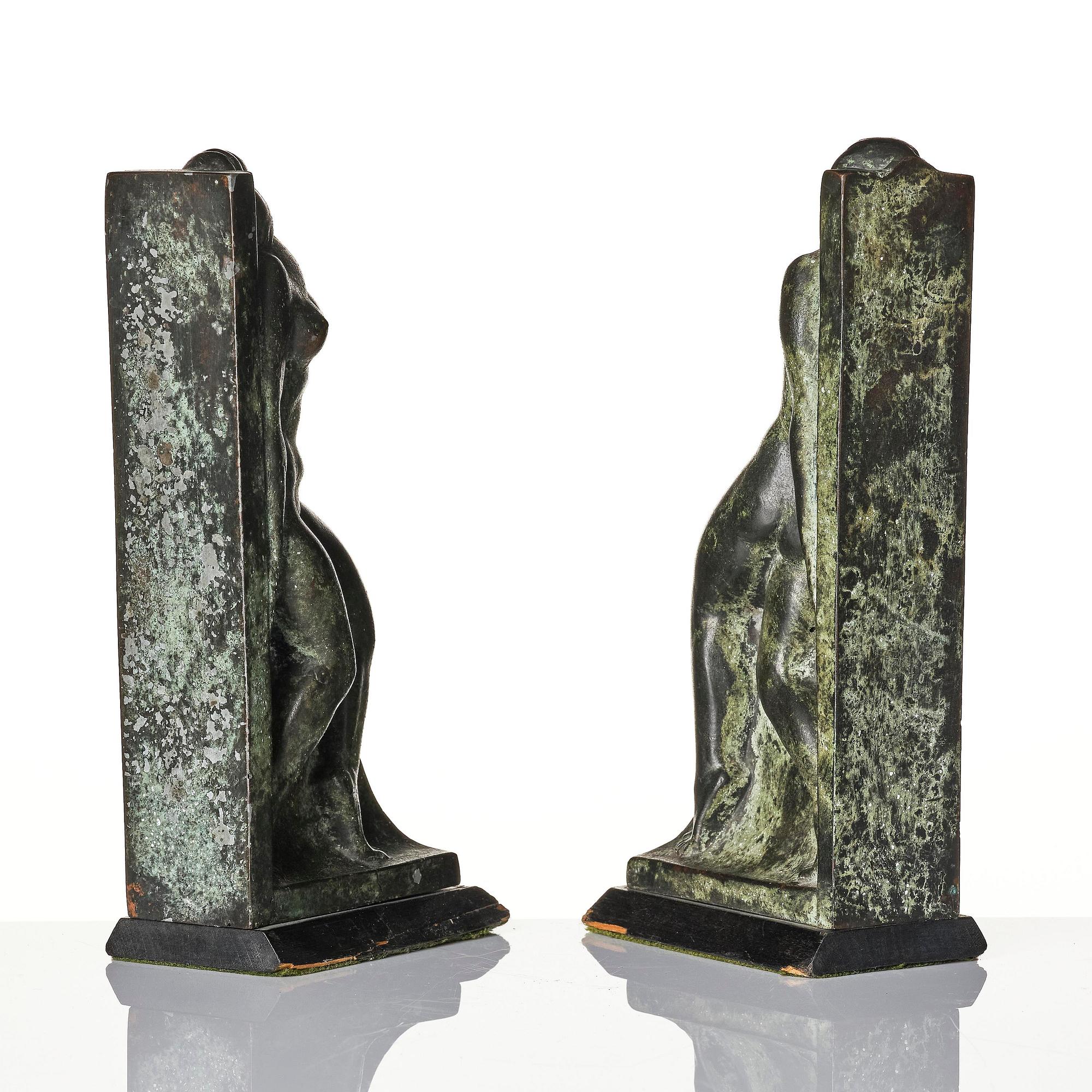 Axel Gute, a pair of Swedish Grace patinated bronze bookends, 1920s.