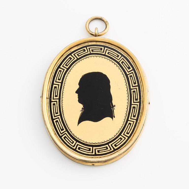 Pendant/memorial medallion with silhouette.