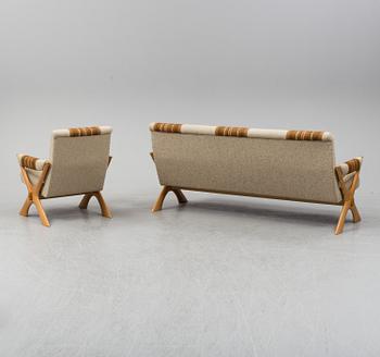 A 1960/70's pine sofa, armchair and coffee table.