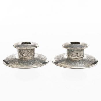 Two pairs of Persian silver candle holders, 20th century.