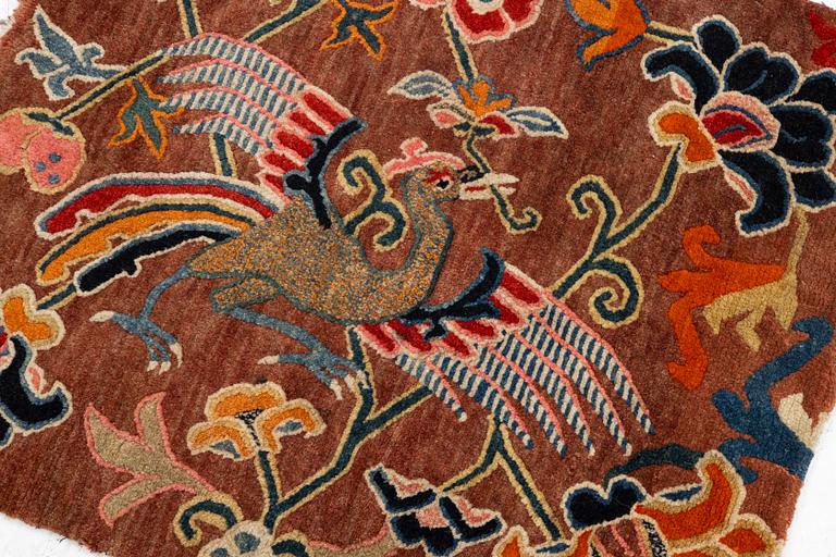 An antique 'Khagangma' rug, Tibet, around 1900. c. 74x63 cm.