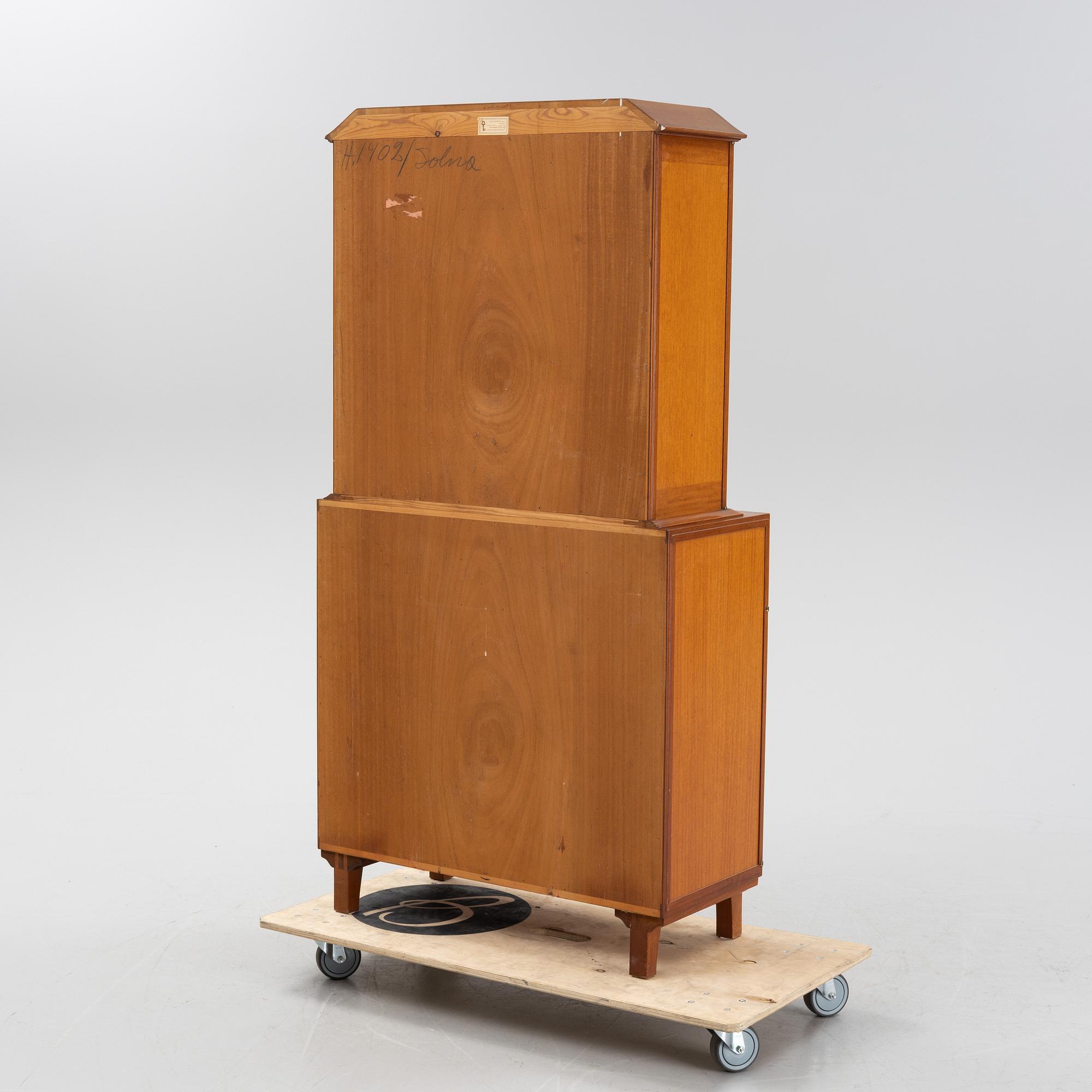 Carl Malmsten, a 'Mittens Rike' mahogany veneered cabinet, Åfors Möbelfabrik, Blomstermåla, dated 1957.