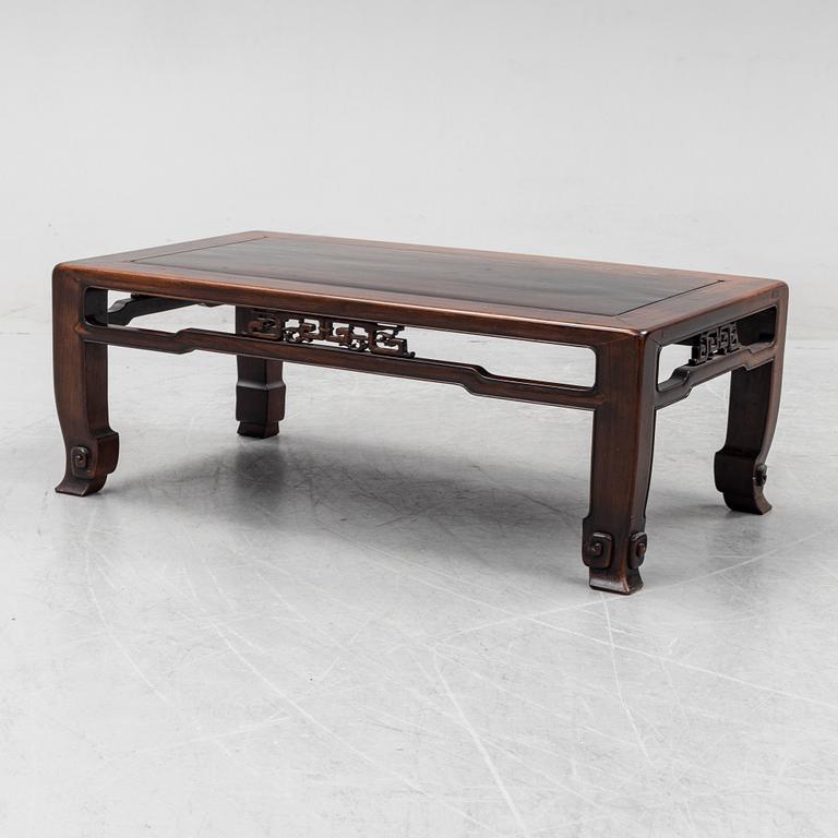 A Chinese hardwood low table, 20th Century.