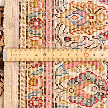 An Oriental silk rug, c. 122 x 76 cm.