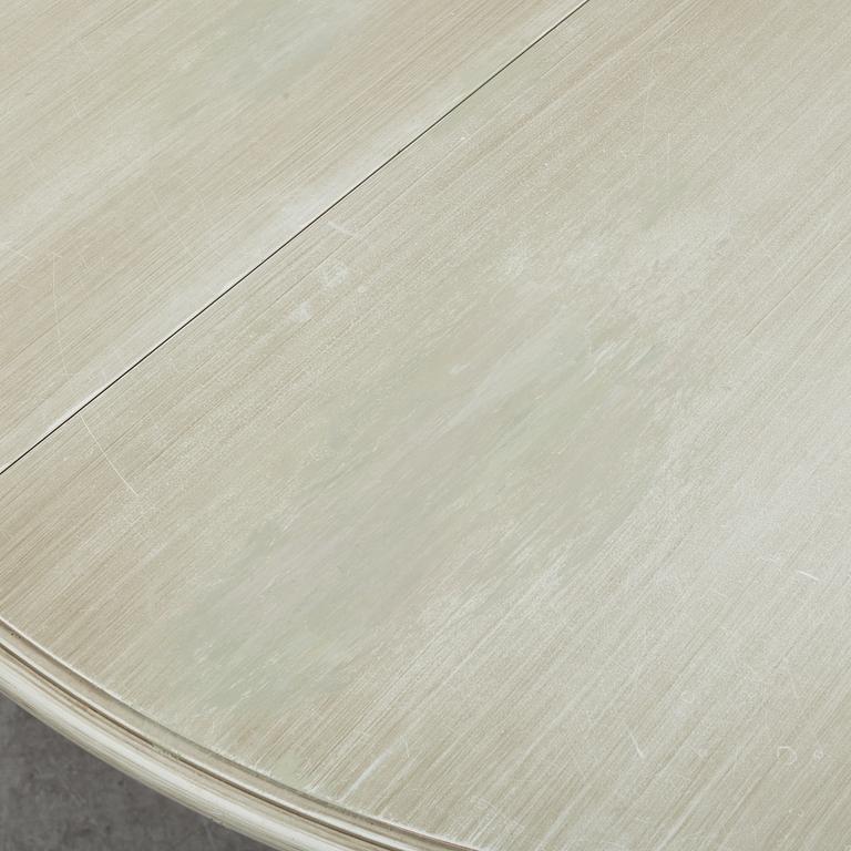 A dining table and six chairs, Gustavian style, second half of the 20th century. One leaf included.