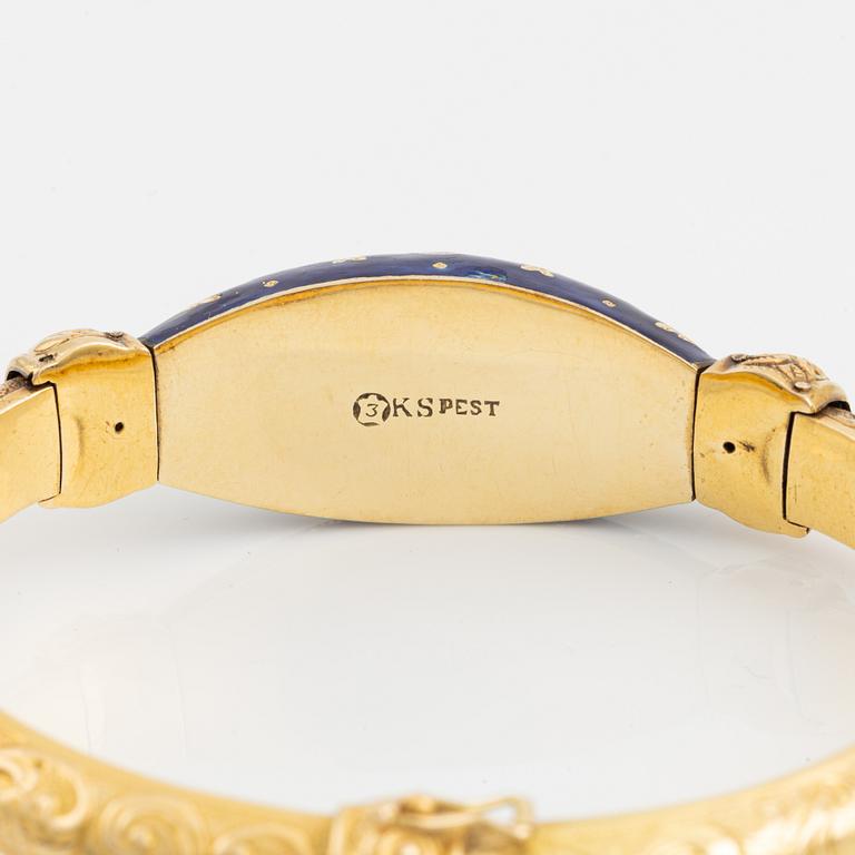 A bangle, gold, blue enamel, and rose cut diamonds.