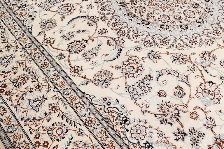 A Nain part-silk carpet, 395 x 293 cm.