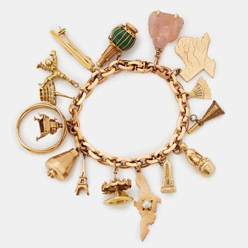 An 18K gold charm bracelet.