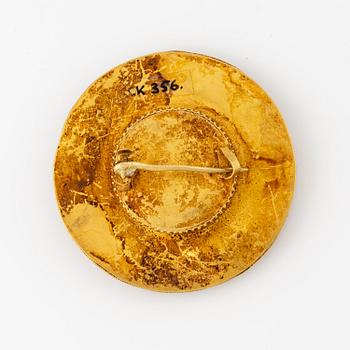 A presumably Roman glass bead in a later gold mount.