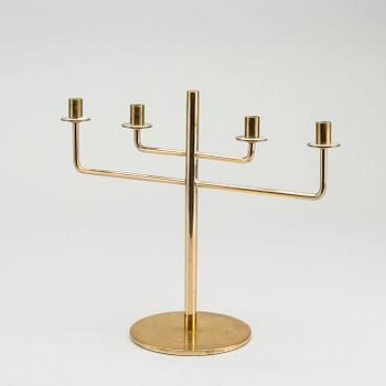 HANS-AGNE JAKOBSSON,  a brass candelabra, later part of the 20th century, height 23,5 cm.